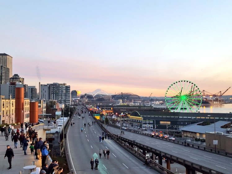 people walking on viaduct, photo by jeff jamawat